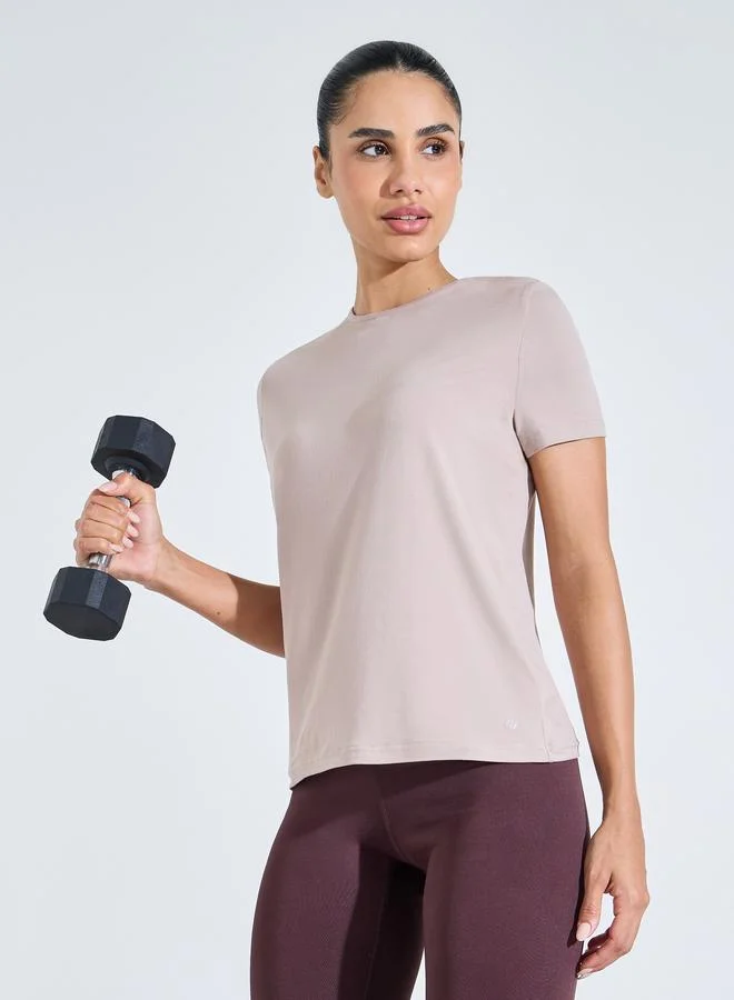 Styli Active Beige Solid Crew Neck Back Peep Active Top