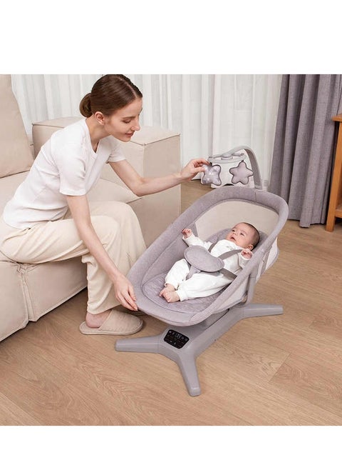 Electric baby rocking bed with music and mosquito net for optimal protection and comfort