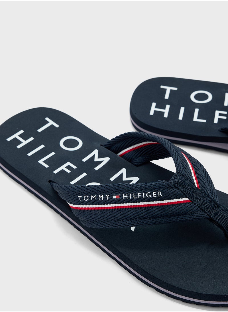 TOMMY HILFIGER - Monogram Beach Flip Flops - Image 1