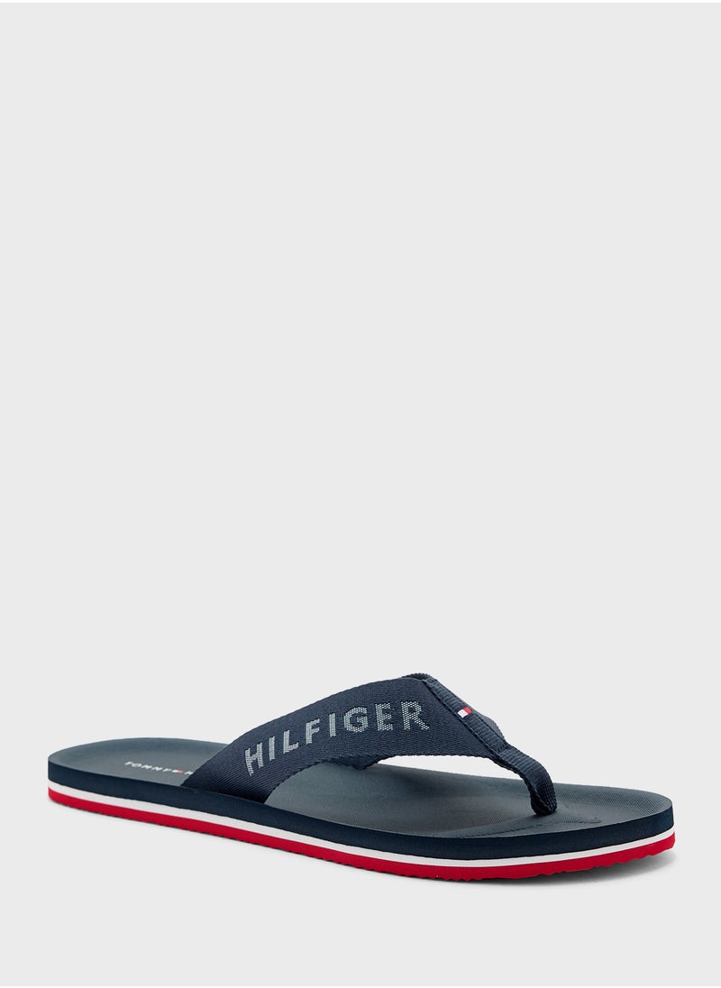 TOMMY HILFIGER - Monogram Beach Flip Flops - Image 1