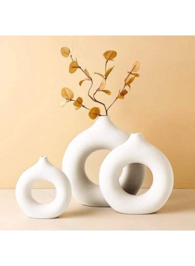 Elegant 3-piece matching vase set with a simple yet elegant design in white.