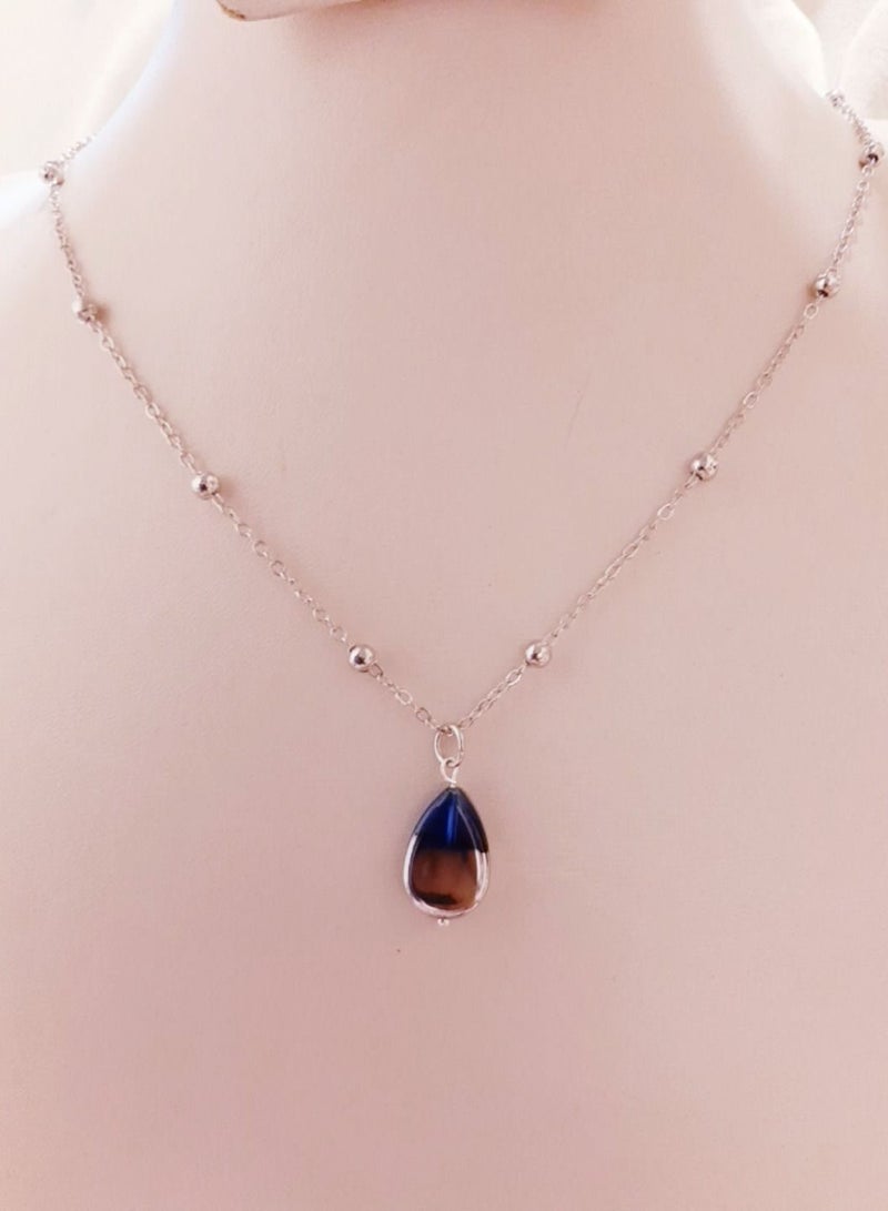 Silvery chain with blue pendant  - Image 1