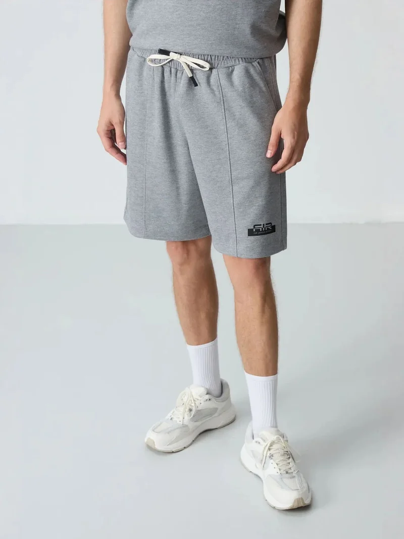 تومي لايف TOMMY Men's Oversized T-Shirt And Shorts Set