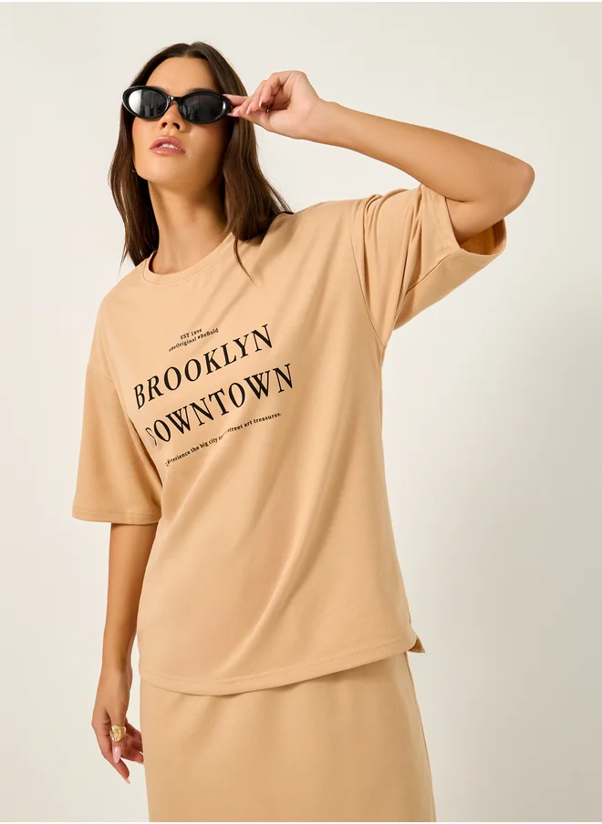 Styli Oversized Graphic Print T-Shirt and Midi Skirt Co-Ords