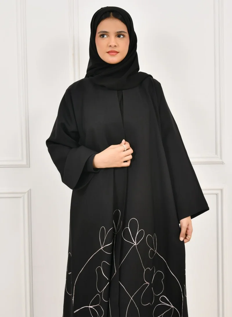 HAWRAA ABAYA Black girls' abaya with floral embroidery at the bottom of the abaya