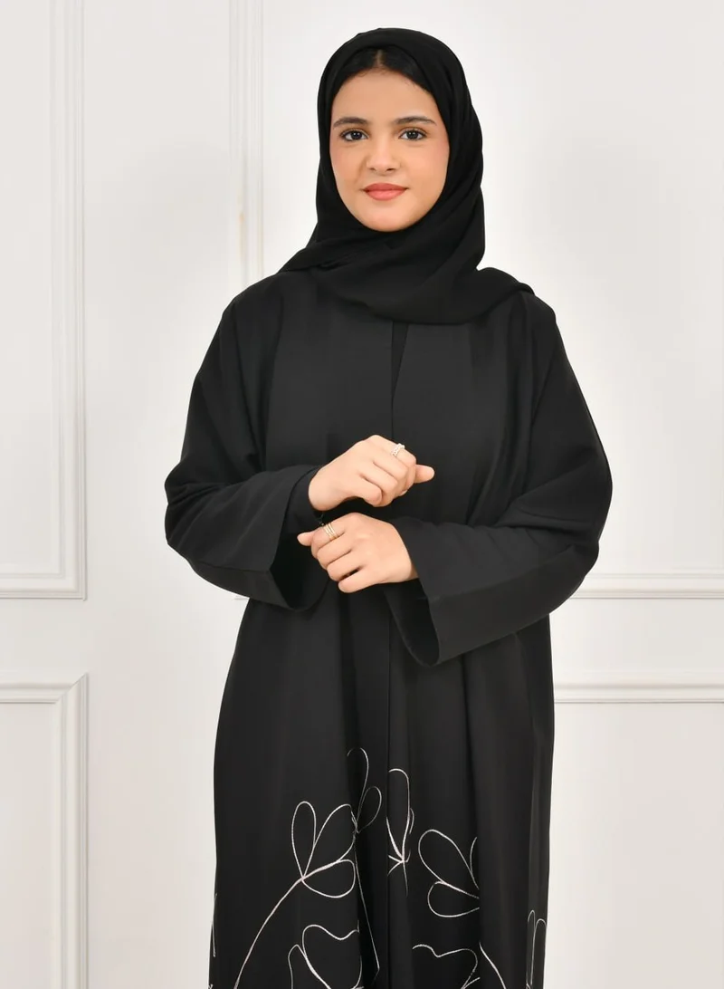 HAWRAA ABAYA Black girls' abaya with floral embroidery at the bottom of the abaya