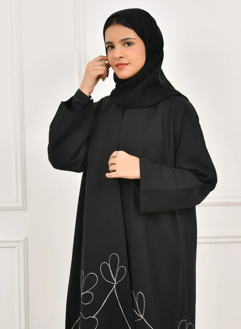 HAWRAA ABAYA Black girls' abaya with floral embroidery at the bottom of the abaya