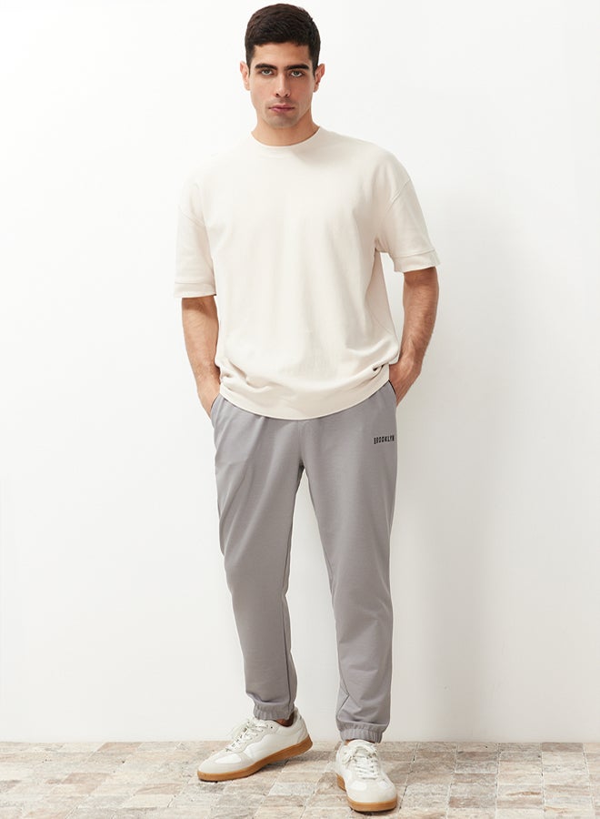 trendyol Gray Regular Fit Printed Elastic Leg Sweatpants TMNSS22EA0121 - Image 5