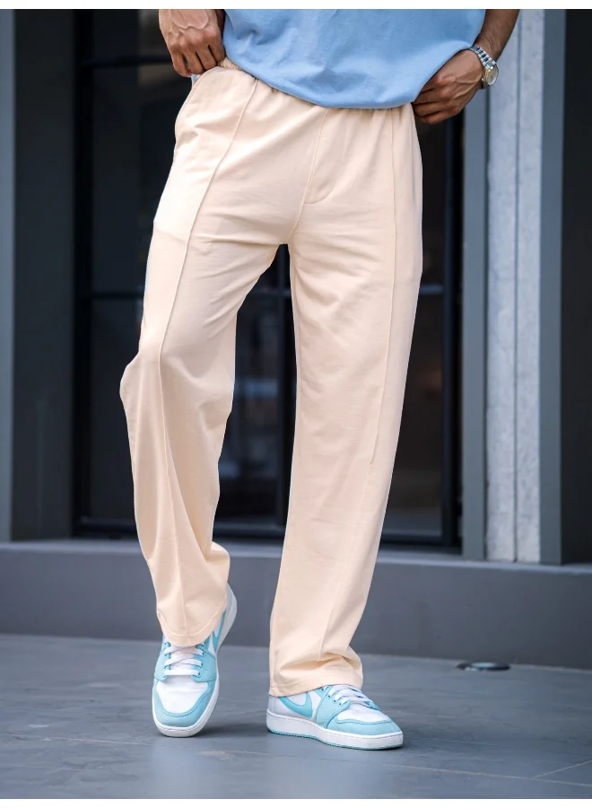 مانياك بنطلون رجالي واسع بلون كريمي سادة