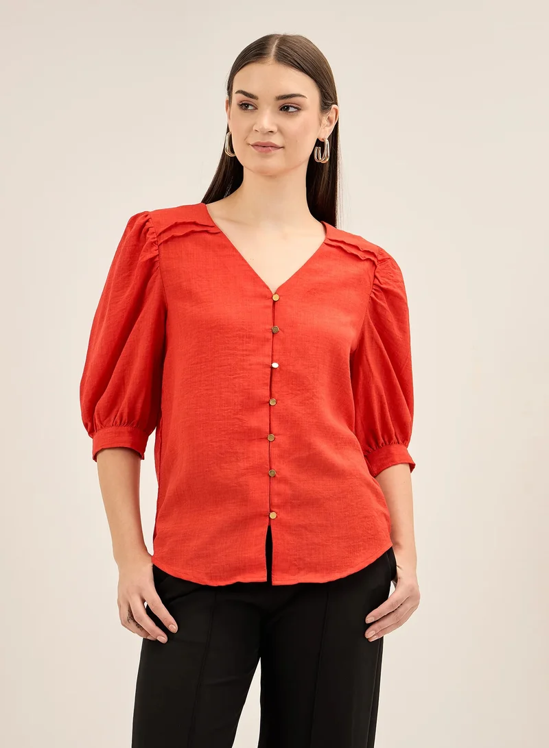 سولت اتاير Women's Red V Neckline Top with Button Down Opening, Pleated Yoke Detail, and Elbow Length Balloon Sleeves for an Elegant and Modern Look