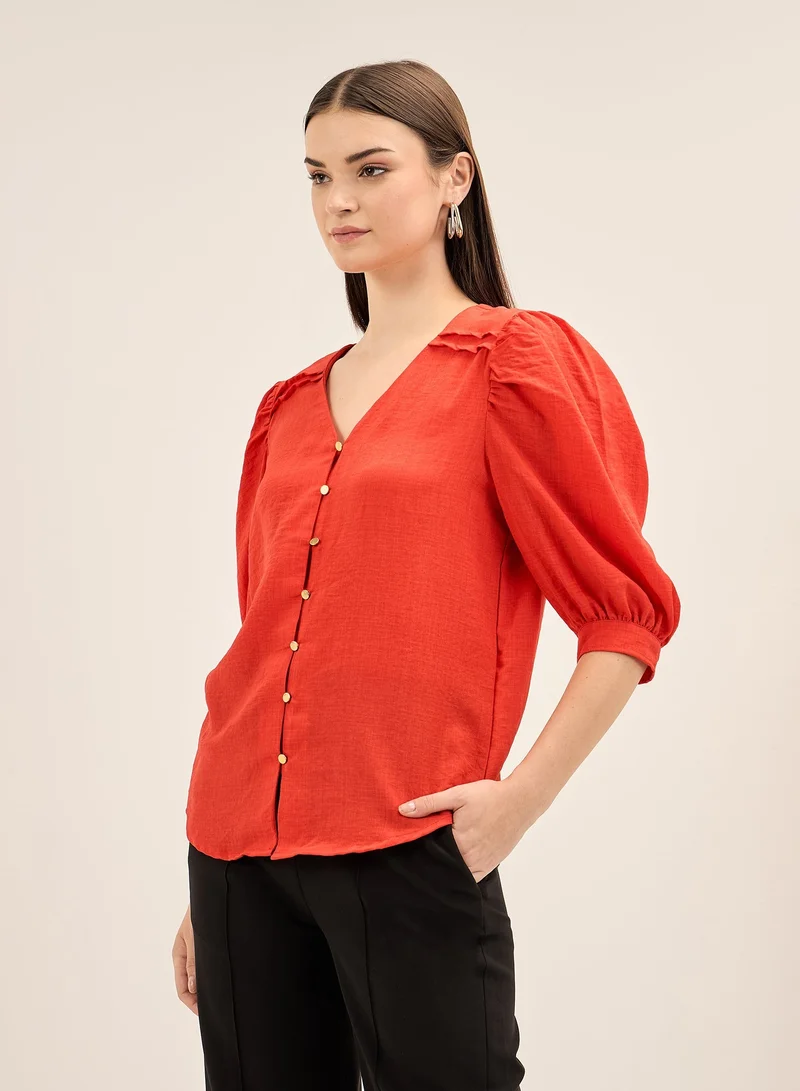 سولت اتاير Women's Red V Neckline Top with Button Down Opening, Pleated Yoke Detail, and Elbow Length Balloon Sleeves for an Elegant and Modern Look