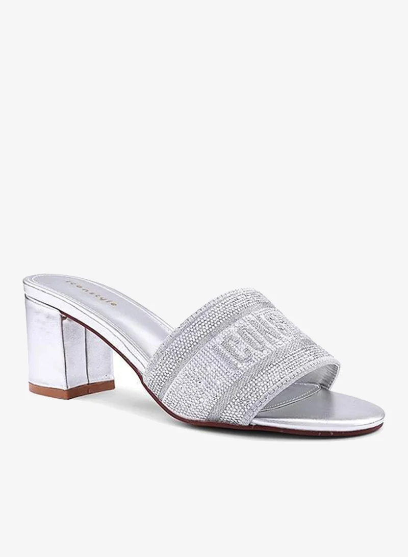 أيقون صنادل بكعب مزينة بأشرطة