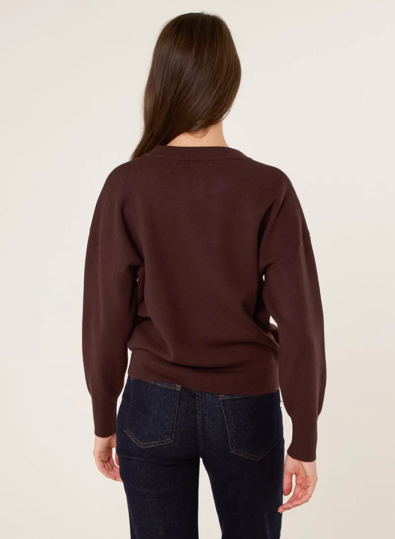 بلو فانيلا كارديجان بأزرار على شكل زهرة ذهبية