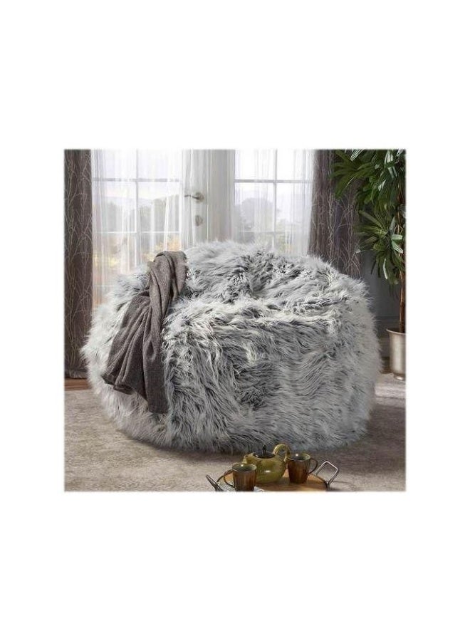 The elegant fur pouf combines maximum comfort with a luxurious look, making it a perfect addition to any home. Gray.