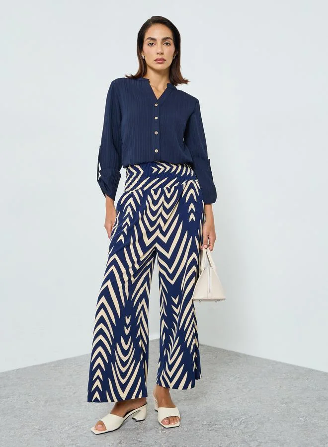 تايك تو بلوزةة بملمس بارز وأزرار أمامية وأكمام قابلة للطي