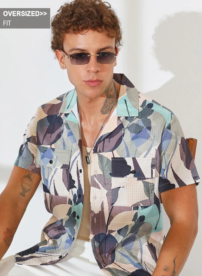Campus Sutra Campus Sutra Men's Multicolour Artistic Bloom Oversized Shirt For Casual Wear | Cuban Collar | Short Sleeve | Button Closure | Oversized Shirt Crafted With Comfort Fit For Everyday Wear