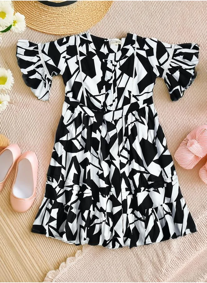بيلا مودا Bella Moda All-Over Printed Ruffled Hem Knee-Length Dress