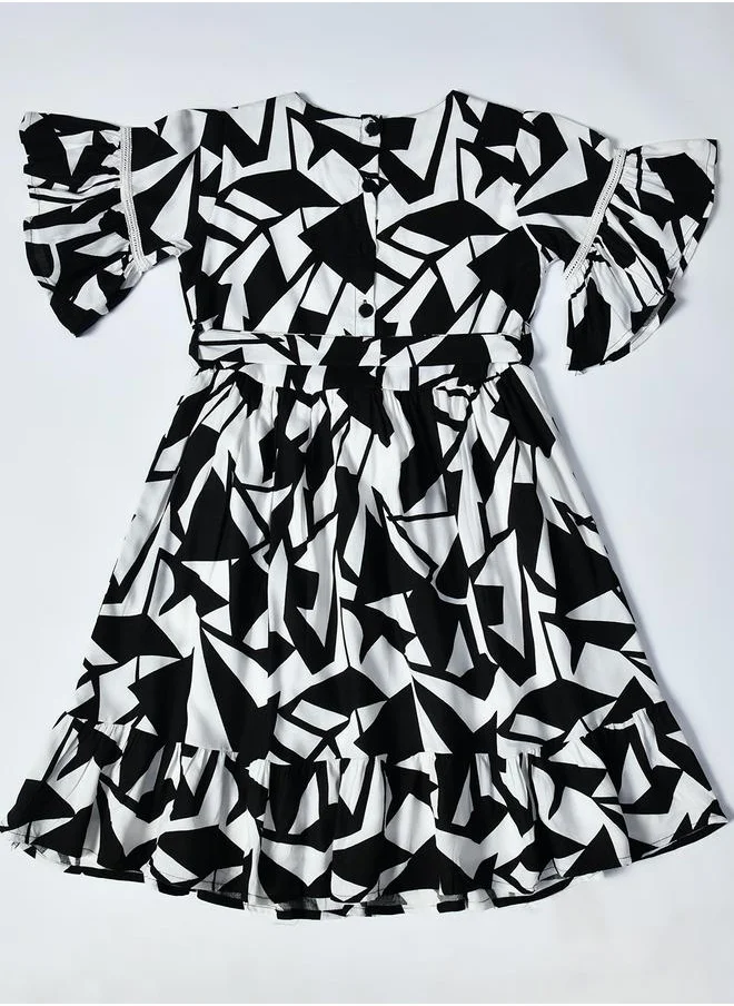 بيلا مودا Bella Moda All-Over Printed Ruffled Hem Knee-Length Dress