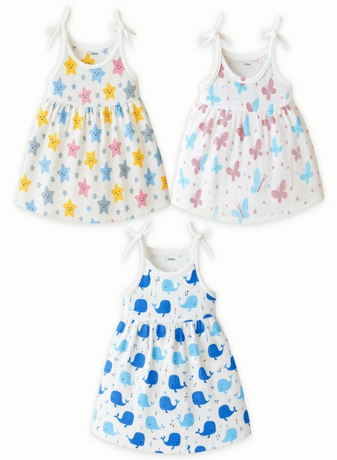 معرف com لهذا التطبيق هو فستان بدون أكمام من القطن العضوي 100% من كيدبيا® لحديثي الولادة | فستان موسلين كاجوال للأطفال الرضع - بنقشة النجوم والفراشات والحوت (9-12 شهرًا) - Image 1