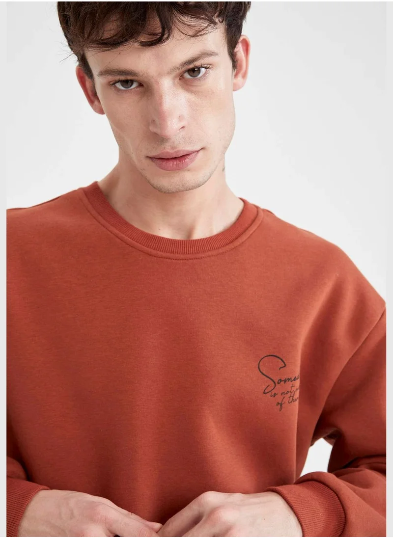 ديفاكتو Boxy Fit Long Sleeve Back Print Sweatshirt