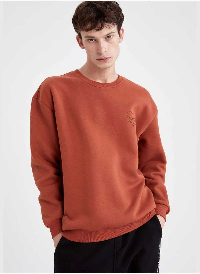 ديفاكتو Boxy Fit Long Sleeve Back Print Sweatshirt