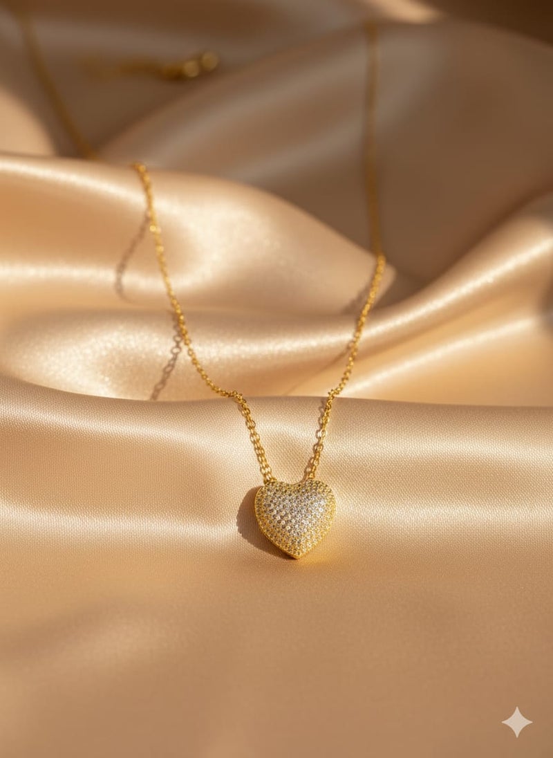 A fully covered, prominent heart-shaped necklace with sparkly, glittery detailing - on a delicate gold-plated chain - with additional links for adjusting the size. - Image 3