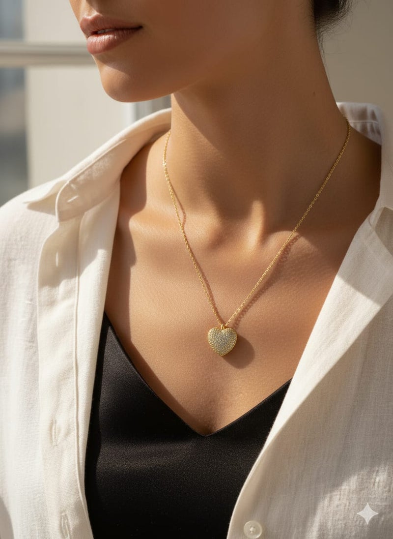 A fully covered, prominent heart-shaped necklace with sparkly, glittery detailing - on a delicate gold-plated chain - with additional links for adjusting the size. - Image 4