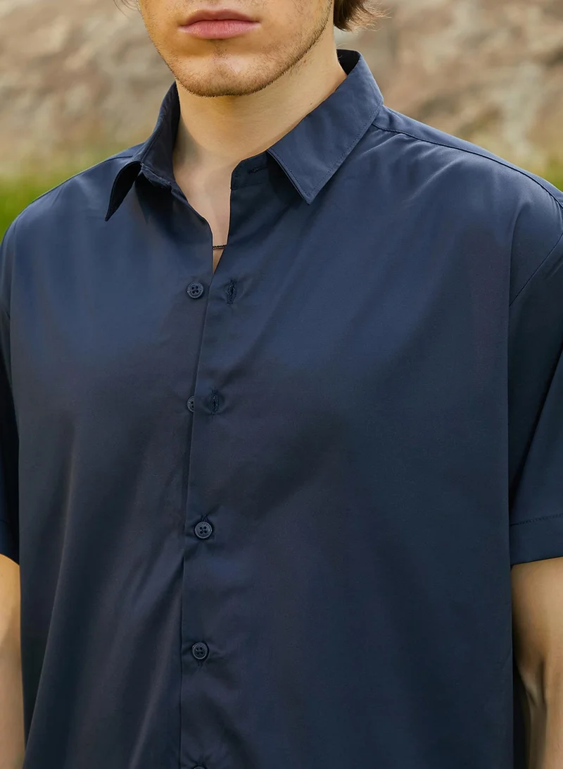 Campus Sutra Campus Sutra Men's Prussian Blue Satin Oversized Shirt For Casual Wear | Spread Collar | Short Regular Sleeves | Button Closure | Oversized Shirt Crafted With Comfort Fit For Everyday Wear