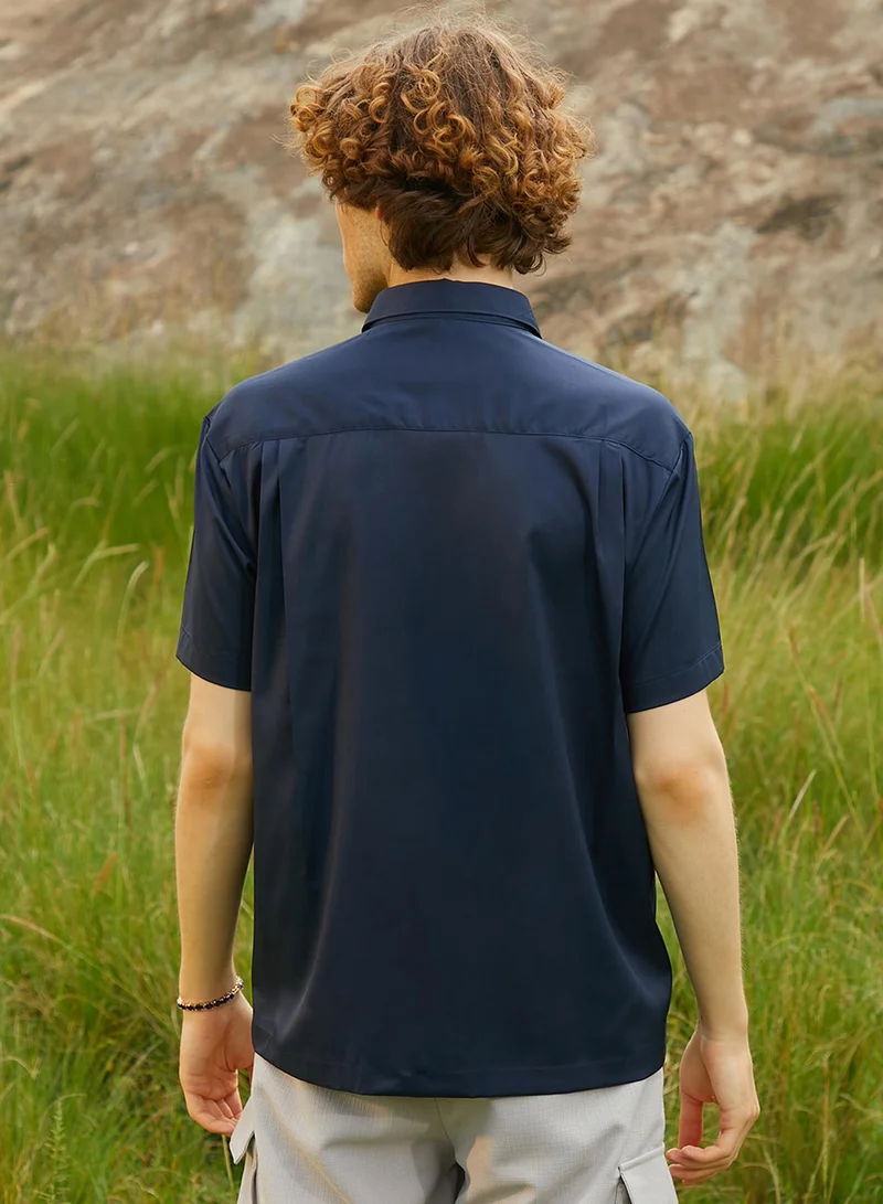 Campus Sutra Campus Sutra Men's Prussian Blue Satin Oversized Shirt For Casual Wear | Spread Collar | Short Regular Sleeves | Button Closure | Oversized Shirt Crafted With Comfort Fit For Everyday Wear