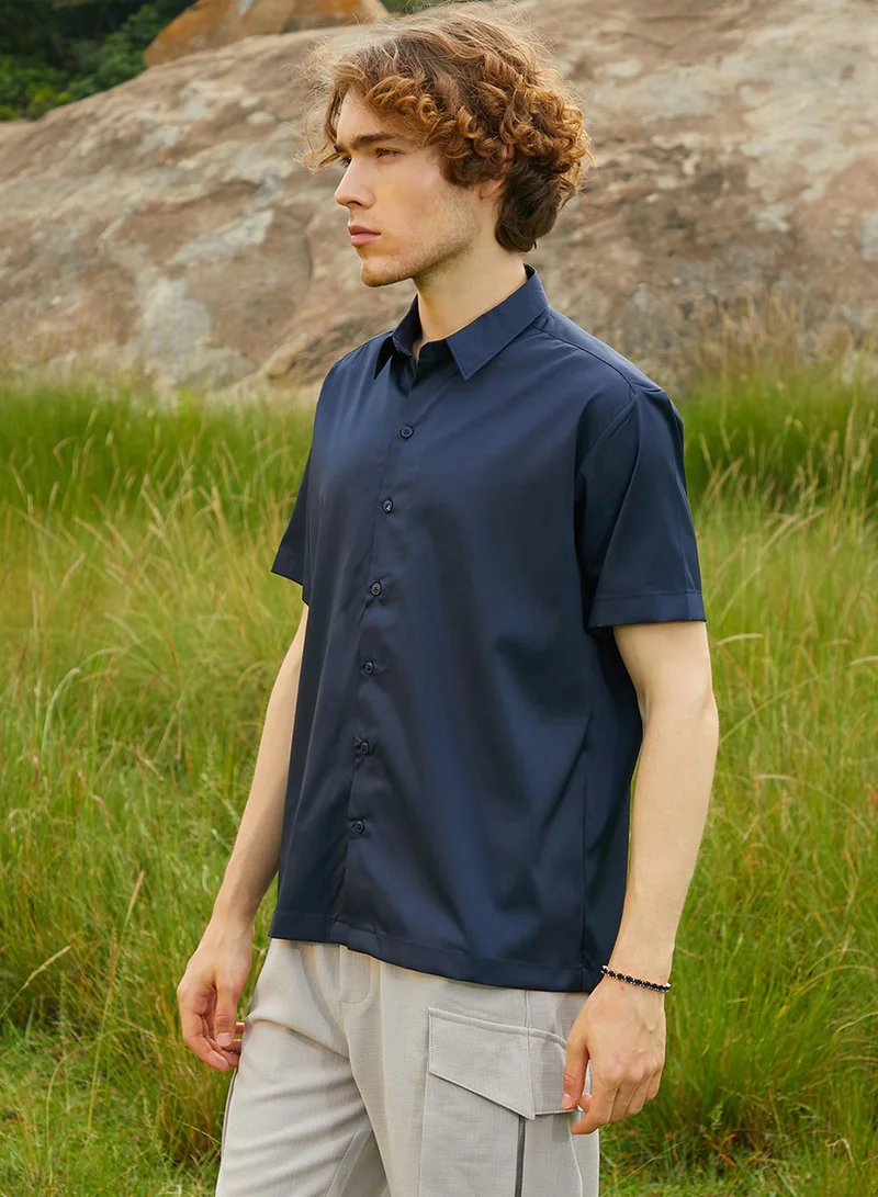 Campus Sutra Campus Sutra Men's Prussian Blue Satin Oversized Shirt For Casual Wear | Spread Collar | Short Regular Sleeves | Button Closure | Oversized Shirt Crafted With Comfort Fit For Everyday Wear