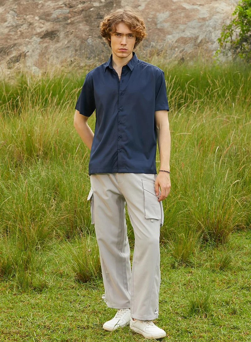 Campus Sutra Campus Sutra Men's Prussian Blue Satin Oversized Shirt For Casual Wear | Spread Collar | Short Regular Sleeves | Button Closure | Oversized Shirt Crafted With Comfort Fit For Everyday Wear