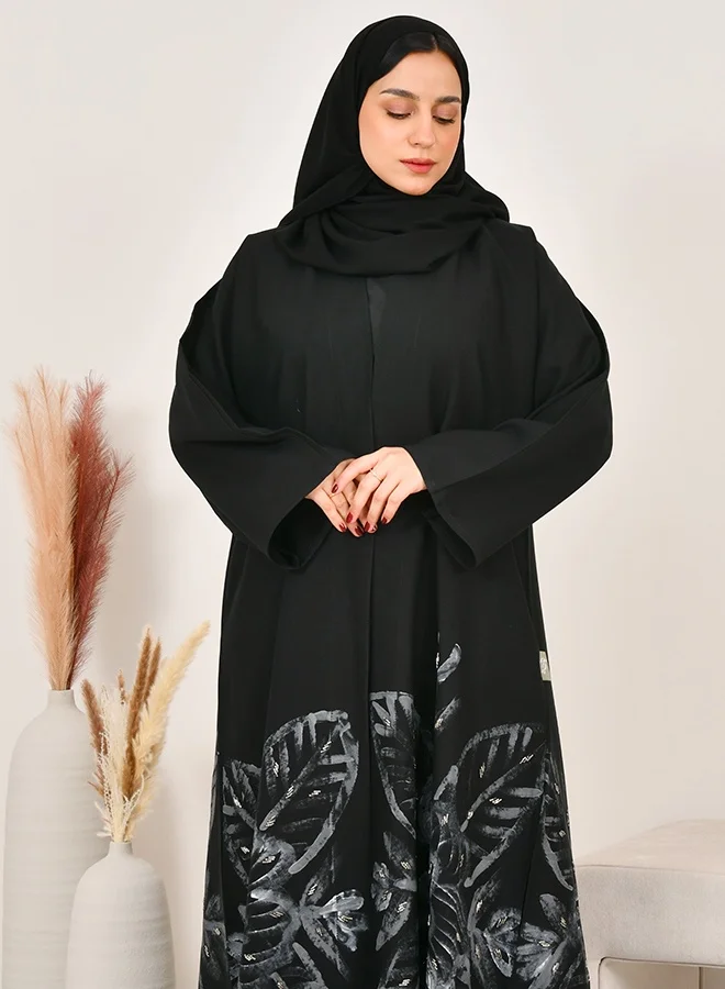 HAWRAA ABAYA Wrap-style flared abaya with a floral print, adorned with soft embellishments at the hem