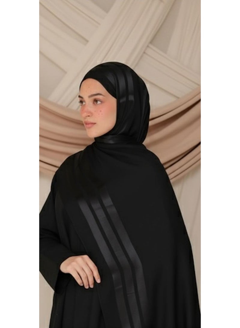 A stylish black chiffon hijab scarf, soft and lightweight, suitable for modest wear.