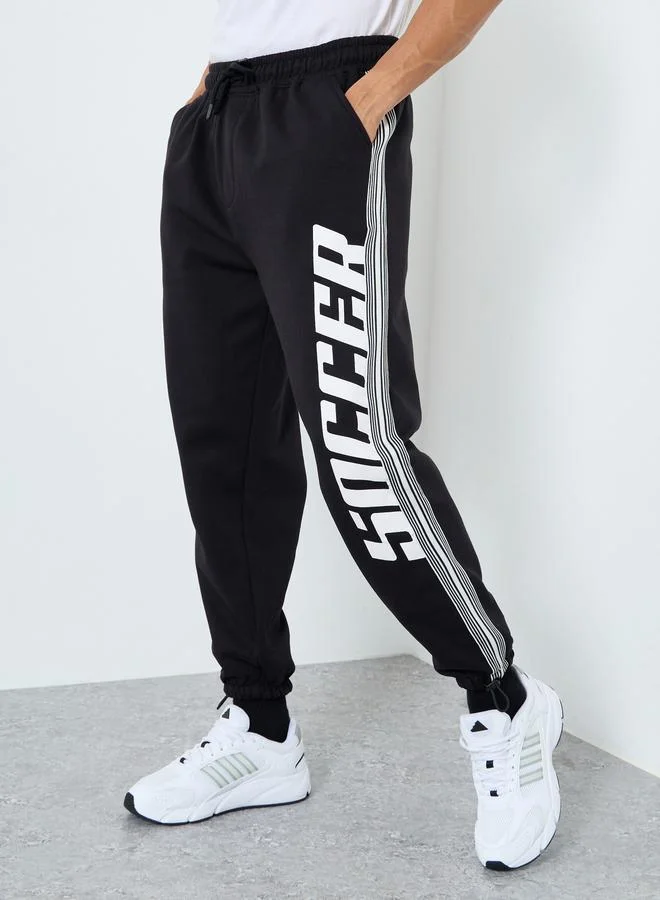 Styli Men Black Graphic Oversized Joggers