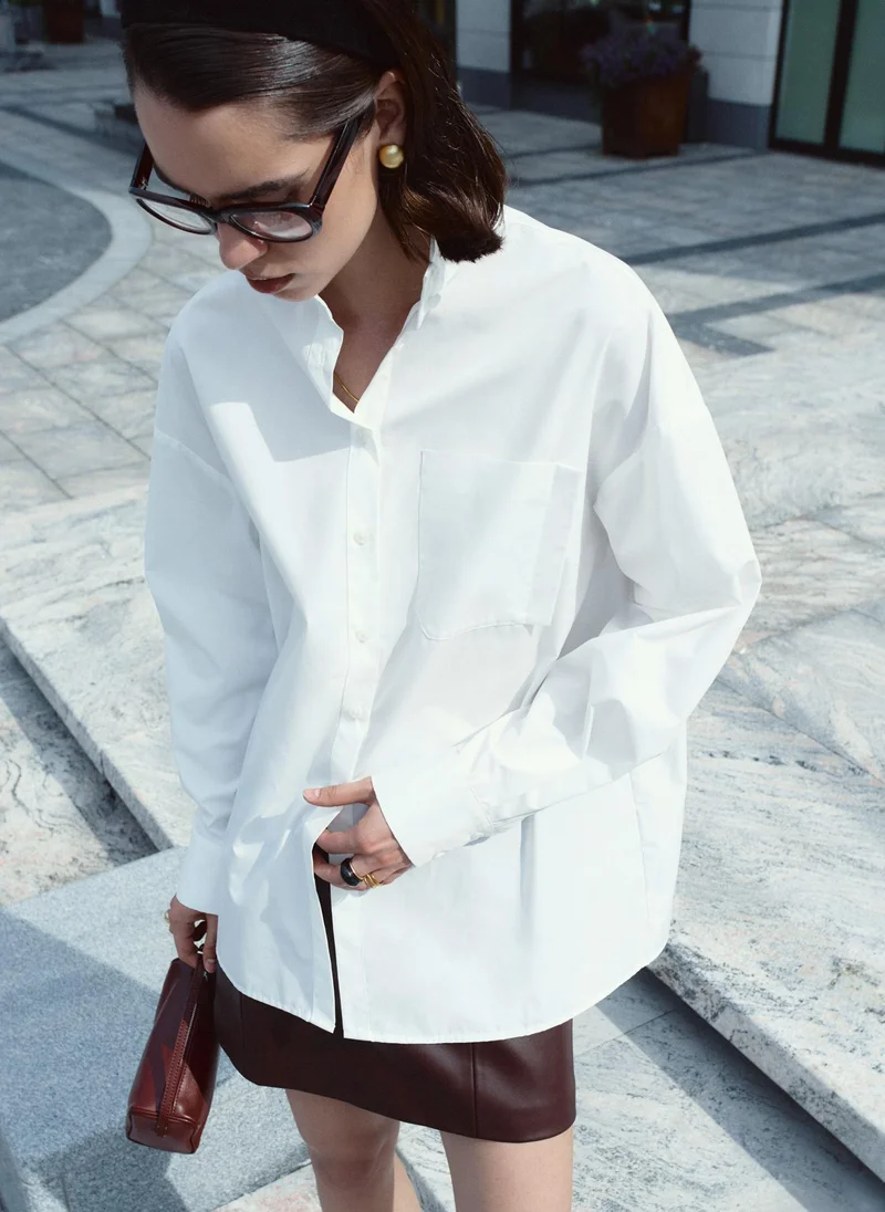 Loose fit shirt with a stand-up collar