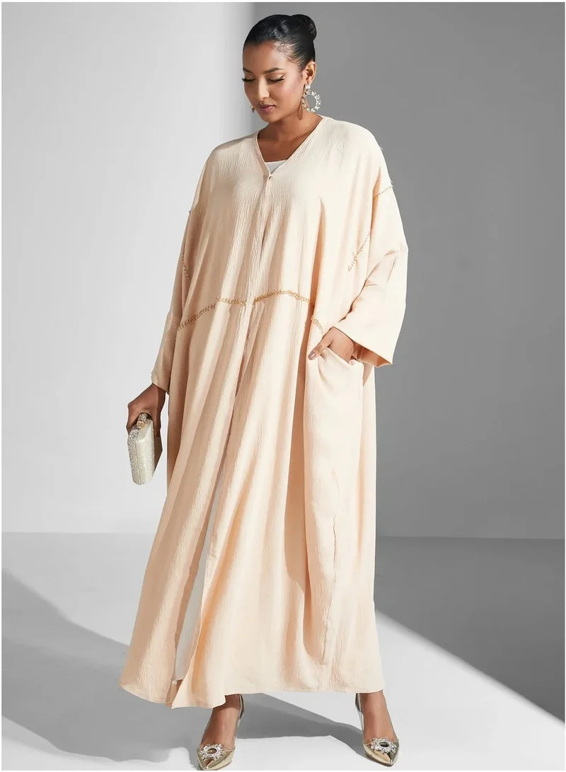Aara Women's Cream Abaya with Wide Sleeves and Gold-Tone Detailing