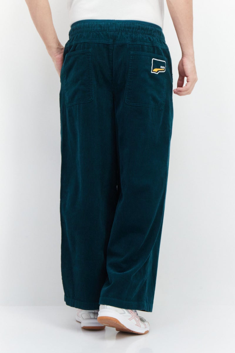 PUMA Men Sportswear Fit Wide Keg Outdoor Pants, Green - Image 2