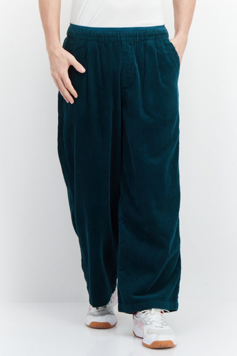 PUMA Men Sportswear Fit Wide Keg Outdoor Pants, Green - Image 1