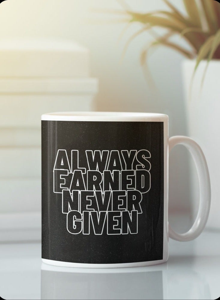 Story Of Candle Ceramic mug with the “ALWAYS EARNED NEVER GIVED” design printed in white  - Image 1