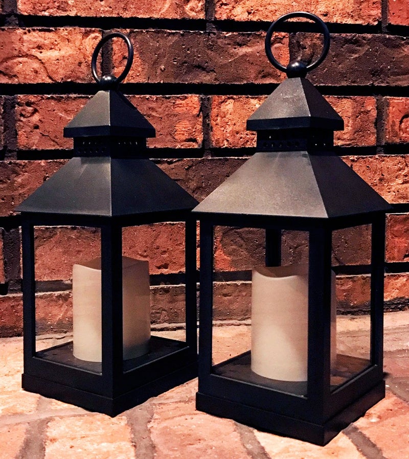 BANBERRY DESIGNS Lighted Decorative Lanterns - 4 Hour Candle Timers - Black Lanterns with Flameless Candles Included - Indoor-Outdoor Lantern Set - Patio Porch Decor- Set of 4. 9 3/8" H - Image 3