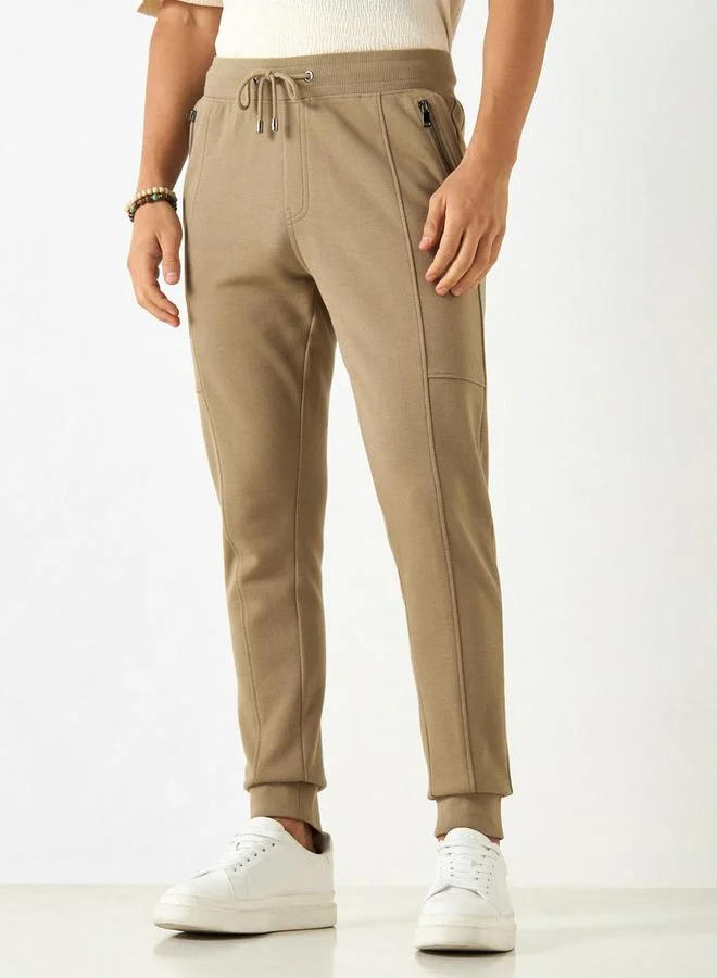 ايكونيك بنطلون رياضي سادة بقصة ضيقة ورباط إغلاق وجيوب من آيكونيك