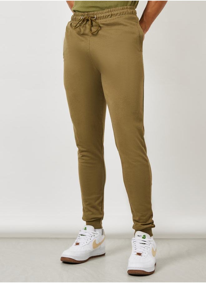 Styli - بنطال رياضي Eco-Earth Slim Fit Terry مع جيوب جانبية - Image 1
