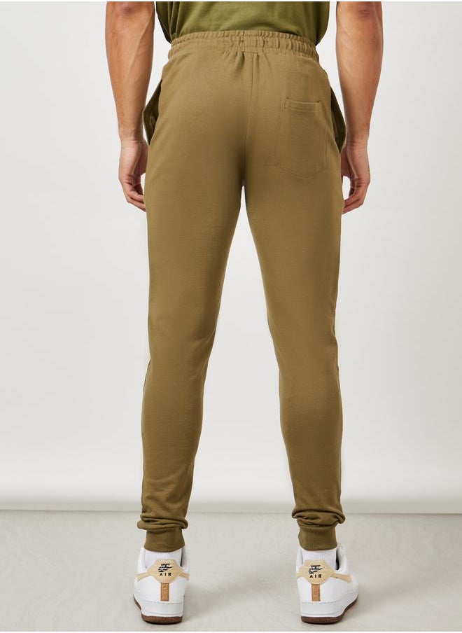 Styli - بنطال رياضي Eco-Earth Slim Fit Terry مع جيوب جانبية - Image 1