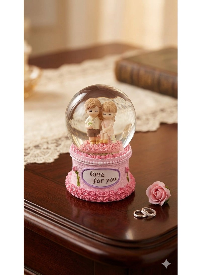 Crystal glass snow globe with feathers, "Love" design, cartoon characters, and decorative base - a luminous gift for any occasion with lighting.