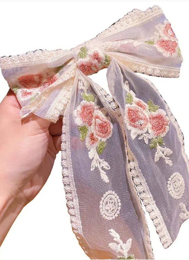 Elevate your look with this luxurious beak hair clip featuring a large bow and elegant floral embroidery! This hair clip adds a soft, romantic touch to your hair. Made from sheer lace embroidered with roses, it's secured with a practical and easy-to-use beak clip. Perfect for special occasions or to pair with a classic, charming look.