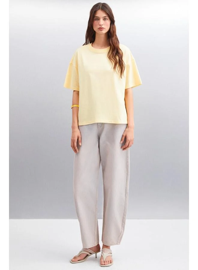 Grimelange Jemmy Women's 100% Organic Cotton Relaxed Fit Slit Round-Neck Yellow T-Shirt.