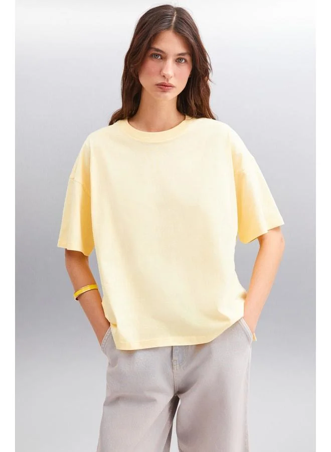 Grimelange Jemmy Women's 100% Organic Cotton Relaxed Fit Slit Round-Neck Yellow T-Shirt.