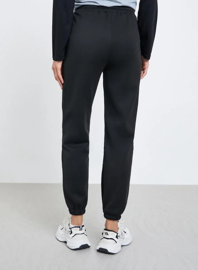 تايك تو بنطال جوغر سادة بحافة مطاطية