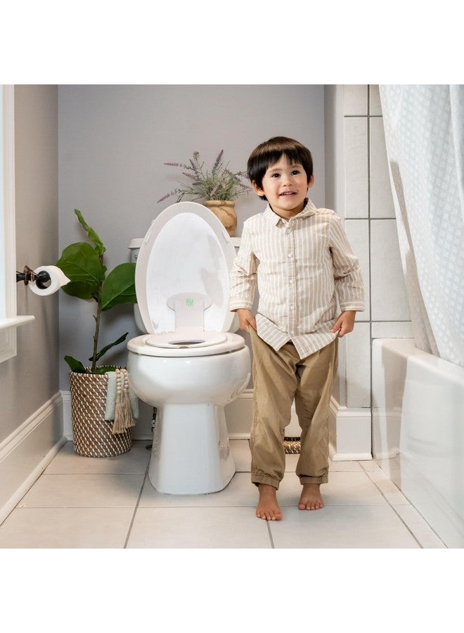 إنجنيونتي Ingenuity: مقعد تدريب على استخدام المرحاض قابل للطي والجلوس من Ingenuity (أبيض) - سهل التركيب والإزالة، يُربط بمقعد المرحاض للبالغين - Image 1