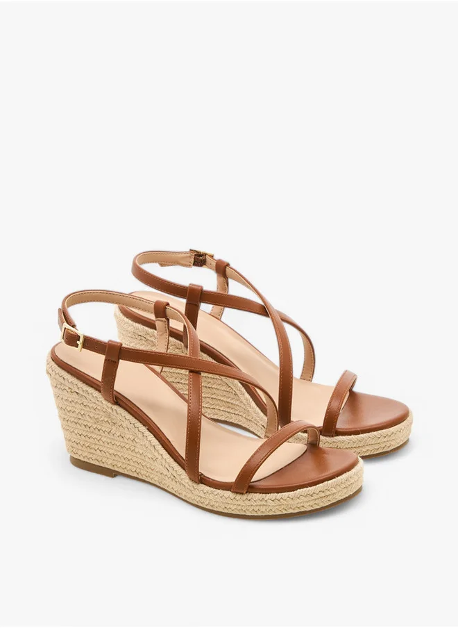 فلورا بيلا من شو إكسبرس Textured Cross-Strap Wedge Heel Sandals with Hook and Loop Closure